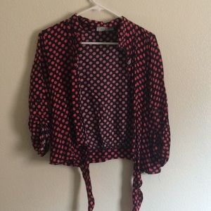 Button up, red polka-dot top with ties.